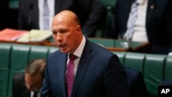 FILE - Australian Home Affairs Minister Peter Dutton addresses Parliament House in Canberra, July 24, 2019. 