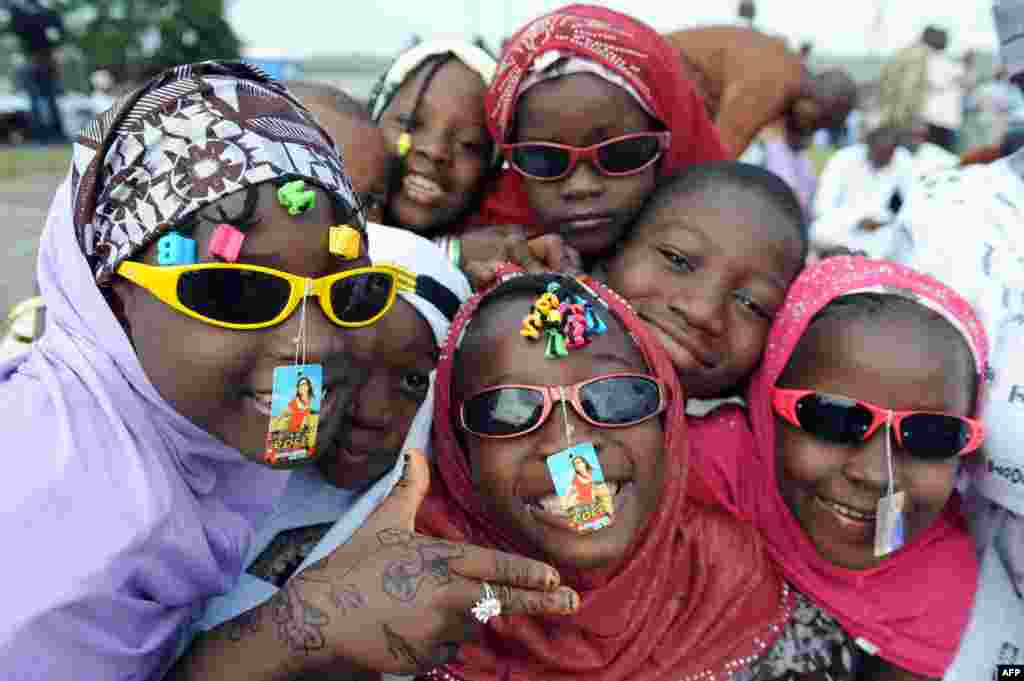 Children pose at Obalende praying ground in Lagos as muslims pray on the first day of Eid al-Fitr, August 19, 2012.