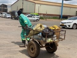 Banana vendor Brian Mutera says he is yet to receive government assistance promised last March, unlike the situation in other countries worldwide, Harare, Jan. 30, 2021. (Columbus Mavhunga/VOA)