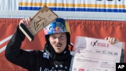 Winner Alex Pullin from Australia cheers at the snow boarding cross World Cup in Feldberg, Germany, Feb. 12, 2017. Two-time world snowboard champion and Winter Olympian Alex Pullin drowned on July 8, 2020, while spearfishing on Australia’s Gold Coast. 