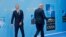 President Donald Trump walks away after being greeted by NATO Secretary General Jens Stoltenberg (L) before a summit of heads of state and government at NATO headquarters in Brussels on July 11, 2018.