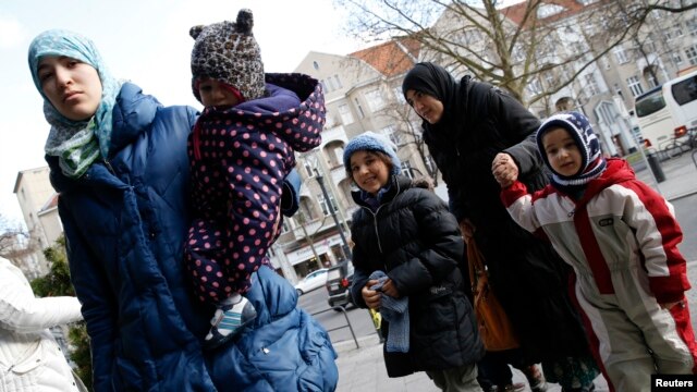 Migrants arrive at a refugee shelter in Friedenau city hall in Berlin's Tempelhof-Schoeneberg district, Germany, Feb. 26, 2016.