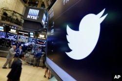 FILE - The Twitter symbol appears above a trading post on the floor of the New York Stock Exchange, July 27, 2016. Twitter, long criticized as a hotbed for online harassment, has been expanding ways to curb the amount of abuse users see.
