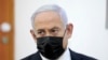 Нетаньяху предстал перед судом, в то время как коалиционные переговоры продолжаются