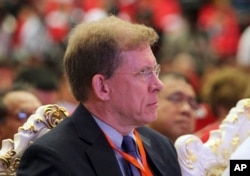 U.S. Deputy Assistant Secretary for Southeast Asia W. Patrick Murphy listens to Myanmar's leader Aung San Suu Kyi's televised speech to the nation at the Myanmar International Convention Center in Naypyitaw, Myanmar, Sept. 19, 2017.