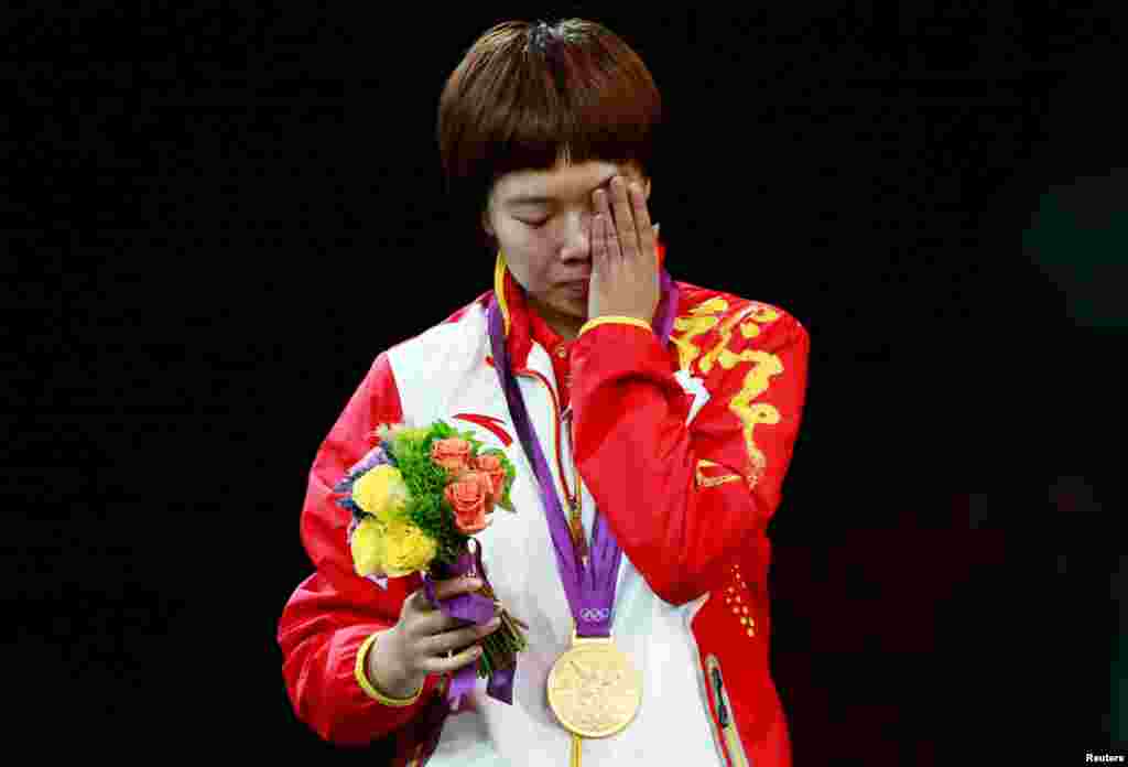 China's Li Xiaoxia after being presented with her gold medal at the women's singles table tennis tournament finals.