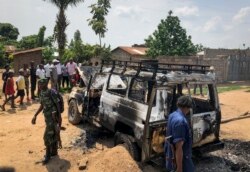 Congolese security forces attend the scene after the vehicle of a health ministry Ebola response team was attacked in Beni, northeastern Congo Monday, June 24, 2019.