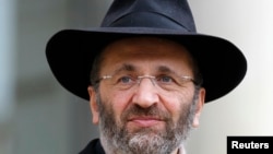 Chief Rabbi of France Gilles Bernheim leaves after a meeting at the Elysee Palace in Paris December 16, 2011.