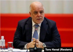 FILE - Iraqi Prime Minister Haider al-Abadi speaks during a conference in Tokyo, Japan, April 5, 2018.