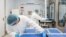 FILE - Lab technicians load vials of investigational coronavirus disease (COVID-19) treatment drug remdesivir at a Gilead Sciences facility in La Verne, California, March 18, 2020. (Gilead Sciences)