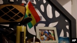 FILE - A family photo of Keachia Bowers, Damon Smith, and their children sits in their home in Accra, Ghana, Dec. 6, 2024. The family relocated to Ghana from Florida and has obtained Ghanaian citizenship.