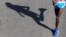 FILE - The shadow of runner is seen in the Nairobi Marathon.