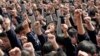 FILE - Students yell slogans such as "I must go to college" and "Father and mother, I love you" following the instructions of a lecturer during a speech at a high school in Nanjing, Jiangsu province March 28, 2012. The speech aims to boost the morale of s