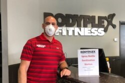 Gym co-owner Mike Martino wears a mask to protect against the coronavirus at Bodyplex Fitness Adventure in Grayson, Ga., on April 24, 2020.