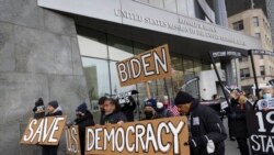 FILE - Activists from Fair Elections for New York, Black Voters Matter and Workers Circle march for voting rights outside the U.S. Mission to the United Nations as President Joe Biden opens a global democracy summit, Dec. 9, 2021, in New York.