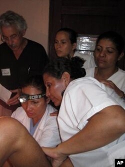 Dr. Art Levit, (left) a PINCC volunteer, supervises doctors during an examination in Jalapa, Nicaragua.