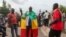 FILE - Thousands march, July 10, 2020, in Bamako, Mali, in anti-government demonstrations urged by an opposition group that rejects the president's promises of reforms.