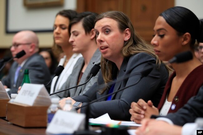 FILE - Army Staff Sgt. Patricia King, second from right, and other transgender military members testify about their military service before a House Armed Services Subcommittee on Military Personnel hearing on Capitol Hill in Washington, Feb. 27, 2019.