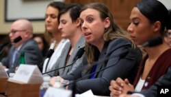 FILE - Army Staff Sgt. Patricia King, second from right, together with other transgender military members testify about their military service before a House Armed Services Subcommittee on Military Personnel hearing on Capitol Hill in Washington, Feb. 27, 2019.