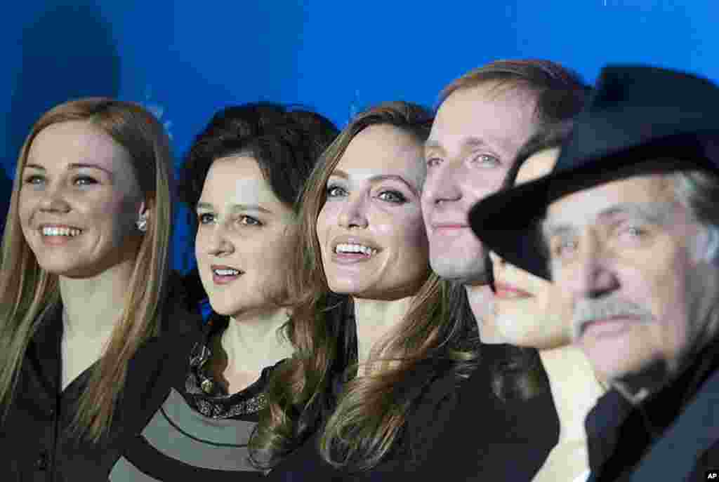 Actors Alma Terzic, Vanesa Glodjo, director Angelina Jolie, actors Goran Kostic, Zana Marjanovic and Rade Srbedzija, from left, pose for the photo call of the film "In the Land of Blood and Honey" in Berlin, February 11, 2012. (AP)