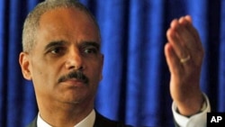 U.S. Attorney General Eric Holder speaks during a news conference in Hong Kong, 19 Oct. 2010