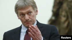 Spokesman Dmitry Peskov gestures at the Kremlin in Moscow, Russia, March 26, 2018. 