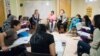 A discussion group at Women for Afghan Women headquarters in Queens, New York. (Credit: WAW)
