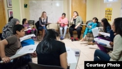 A discussion group at Women for Afghan Women headquarters in Queens, New York. (Credit: WAW)