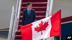 FILE - Canadian Prime Minister Justin Trudeau arrives at Andrews Air Force Base, in Maryland, July 8, 2024, to attend a NATO summit in Washington.