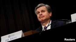 Federal Bureau of Investigation (FBI) Director Christopher Wray testifies before a Senate Intelligence Committee hearing on Capitol Hill in Washington, Feb. 13, 2018.