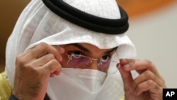 FILE - Nayef Falah Al-Hajraf, secretary-general of the Gulf Cooperation Council, wears a face mask to help curb the spread of the coronavirus as he speaks at a press conference during the 41st GCC meeting being held in Al Ula, Saudi Arabia, Jan. 5, 2021. 