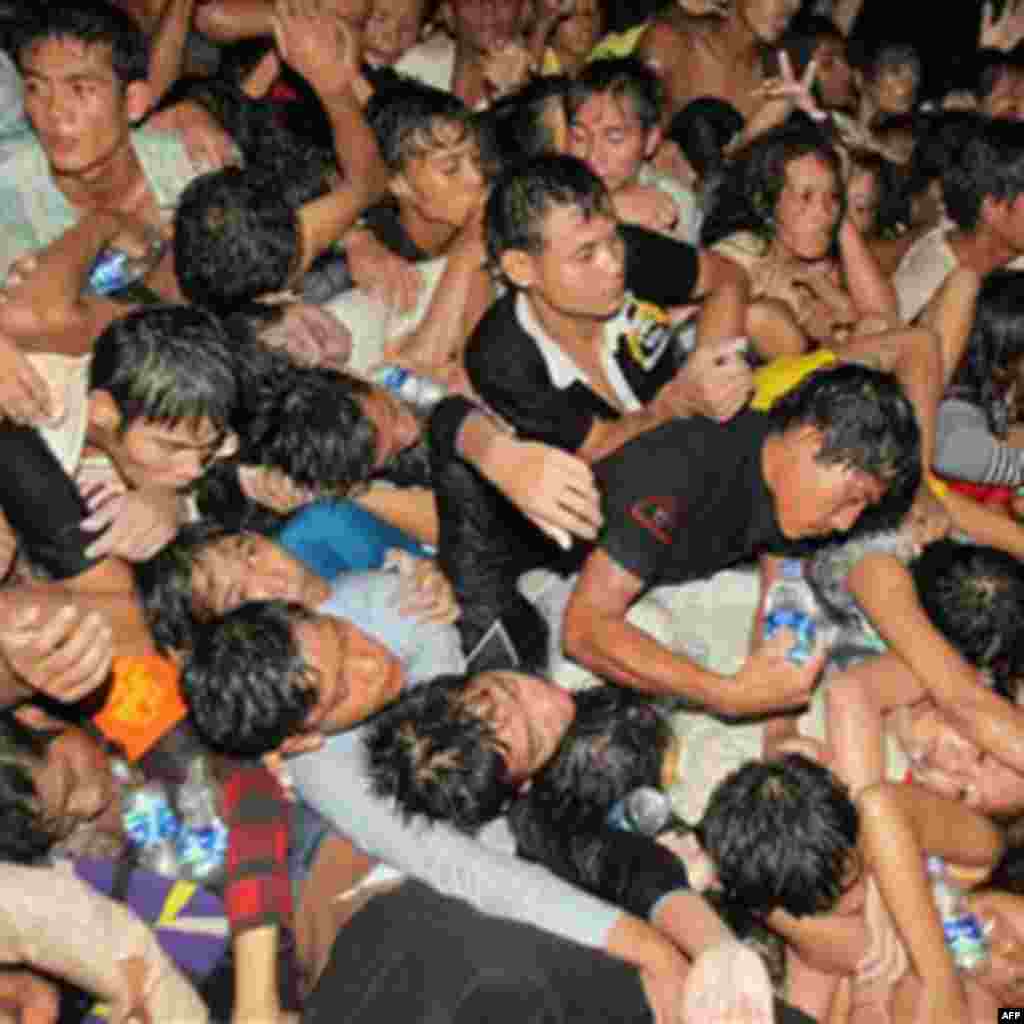 A crowd of Cambodians are pushed onto a bridge on the last day of celebrations of a water festival in Phnom Penh, Cambodia, Monday, Nov. 22, 2010. Thousands of people celebrating a water festival on a small island in a Cambodian river stampeded Monday eve