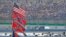 FILE - American and Confederate flags fly over the infield during the NASCAR Sprint Cup Series Quaker State 400 in Sparta, Kentucky, July 11, 2015.