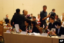 FILE - Prosecutors from Thailand, Japan and other countries talk at a summit on sex trafficking, Sept. 28, 2016, in Honolulu. They called the scourge of sex trafficking a form of modern-day slavery.