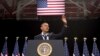 President Barack Obama waves as he arrives to speak about immigration at Del Sol High School, in Las Vegas, Nevada, January 29, 2013.