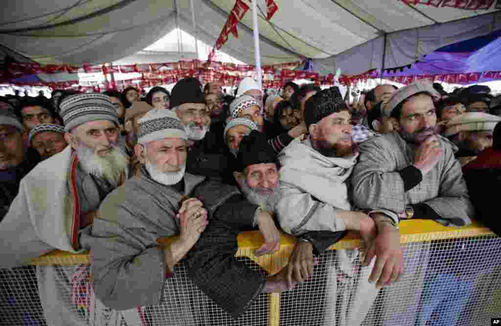 National Conference party supporters attend an election rally on the outskirts of Srinagar, India.