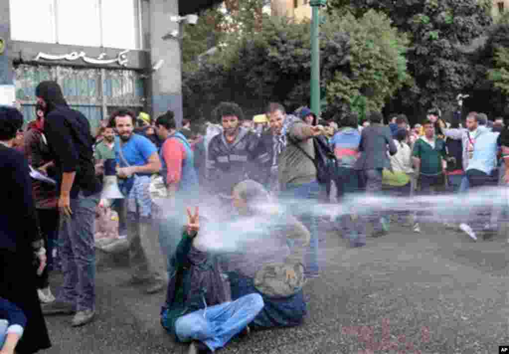 Egyptian police fire water cannons to disperse a protest by secular anti-government activists in Cairo, November 26, 2013.