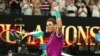 Petenis Spanyol Rafael Nadal merayakan kemenangannya seusai memenangkan pertandingan semifinal tunggal putra melawan petenis Italia Matteo Berrettini pada hari kedua belas turnamen tenis Australia Terbuka di Melbourne, 28 Januari 2022. (Aaron FRANCIS / AFP)