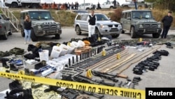 Kosovo police display weapons and military equipment seized during a police operation in the village of Banjska, at a police camp near Mitrovica, Kosovo, September 25, 2023.