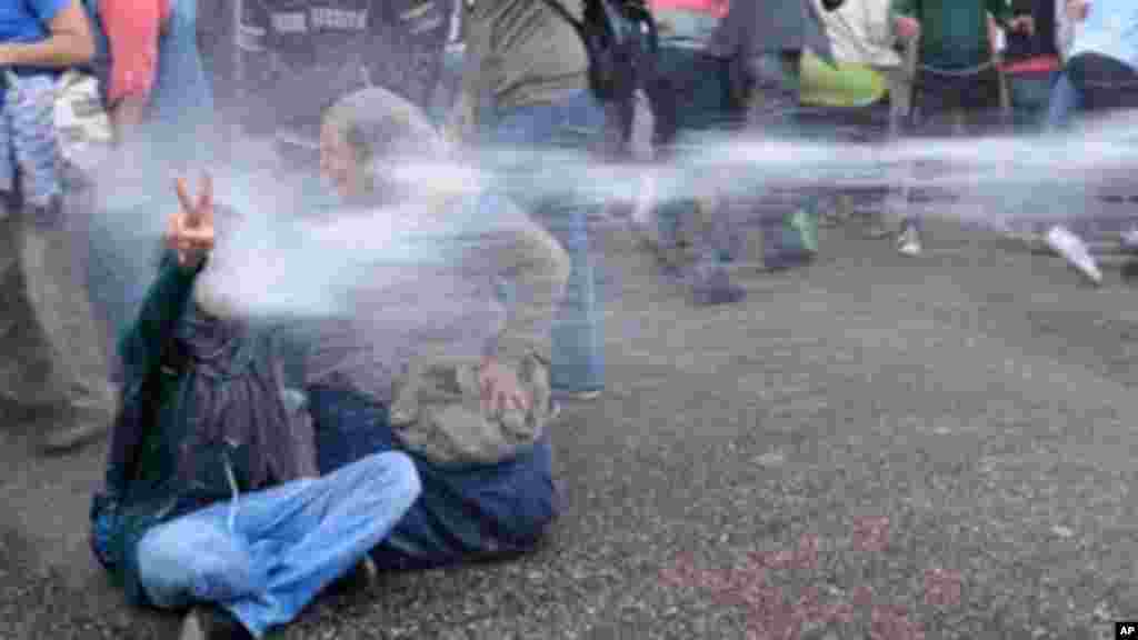 Egyptian police fire water cannons to disperse a protest by secular anti-government activists in Cairo, November 26, 2013.