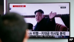 A man watches a TV news program showing a file footage of North Korean leader Kim Jong Un at Seoul Railway Station in Seoul, South Korea, Friday, April 1, 2016.