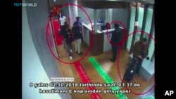 This image taken from surveillance camera shows a still image of people inside Ataturk International Airport, Istanbul, Turkey, on Oct. 2, 2018. The text on the screen from source in Turkish reads: "nine people enter from airport's E Gate on Oct. 2, 2018.