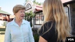 Trish Heslop, left, director of Guild Cottage, talks with one of its residents, Jessica, a teen who suffered sexual abuse when she was younger. Jessica is now undergoing therapy and is a top academic achiever. (D. Taylor/VOA)