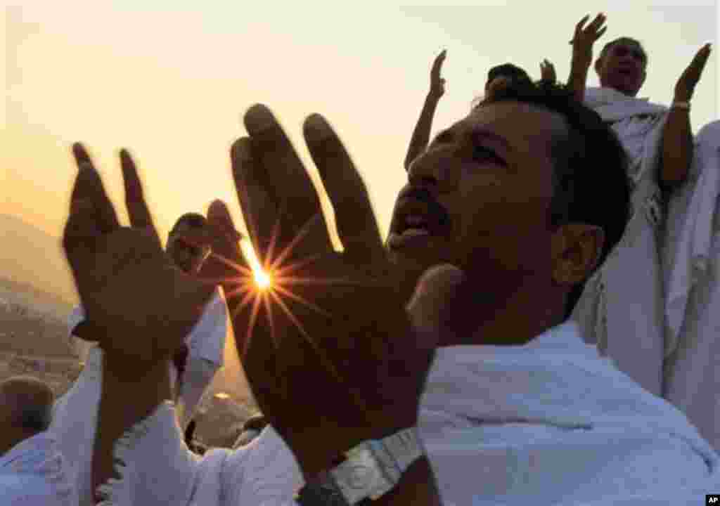 Muslim pilgrims pray on a rocky hill called the Mountain of Mercy, on the Plain of Arafat near Mecca, Saudi Arabia, Monday, Nov. 15, 2010. The annual Islamic pilgrimage draws 2,5 million visitors each year, making it the largest yearly gathering of people