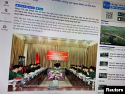 A state media article from March 17, 2021 with a picture of a meeting marking five years since the creation of Vietnam's 'Force 47' cyber army is displayed on screen in this picture takenJuly 8, 2021. (TRUYENHINHNGHEAN.VN via REUTERS)