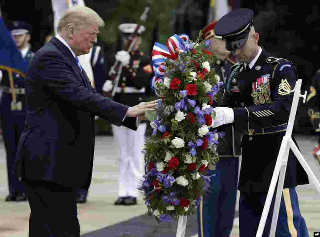 President Donald Trump lays a wreath at the Tomb of the Unknown Solider at Arlington National Cemetery, May 28, 2018, in Arlington, Virginia.