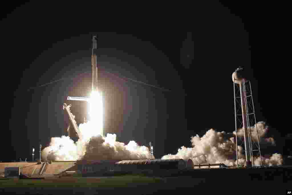 A SpaceX Falcon 9 rocket with the Crew Dragon space capsule lifts off from pad 39A at the Kennedy Space Center in Cape Canaveral, Fla., Friday, April 23, 2021. (AP Photo/John Raoux)