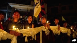 Exile Tibetans participate in a candlelit vigil Dharmsala, India, to express solidarity with a young Tibetan Dorjee Lhundrup who allegedly immolated himself in protest against Chinese rule, November 4, 2012. 