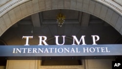 FILE - The exterior of the Trump International Hotel is shown in downtown Washington, D.C., Sept. 12, 2016. President-elect Donald Trump is pulling back from possible projects around the globe as he prepares to take office Jan. 20.