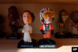 Bobbleheads from the "Star Wars" movies are displayed at National Bobblehead Hall of Fame and Museum in Milwaukee. (AP Photo/Carrie Antlfinger)